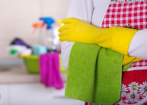 Professional cleaner NW6 following safety procedures